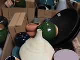 a box full of vases that are sitting on a table