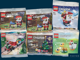 six sets Lego Creator dans des sachets sur un fond bleu
