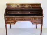 an antique writing desk with two drawers and a marble top