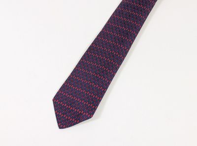 purple and red necktie on a white surface with a white background
