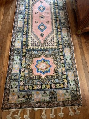an image of a long rug on a wooden floor in a living room