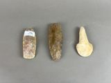 three different types of rocks are shown on a gray surface
