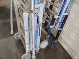 a metal ladder that is sitting next to a pile of boxes