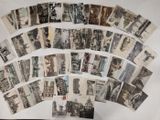 a lot of old black and white photos on a table
