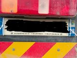 a close up of the back end of a truck that has been painted red and yellow