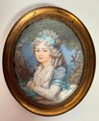 portrait of a lady in a blue dress in a gold frame