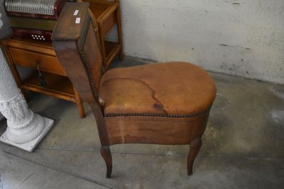 a chair that is sitting in front of a piano