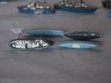 a lot of small boats that are on a table