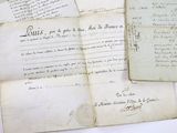 some old papers are sitting on top of a white table
