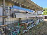 a lot of different types of metal and wood in the yard
