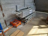 a large stack of pallets sitting in a warehouse