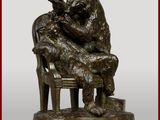 une statue en bronze représentant un ours assis sur une chaise