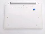 a white laptop with a blue sticker on it