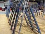 many ladders that are lined up in a room