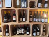 many bottles of wine on the shelves in the store