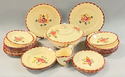 many plates and bowls that are sitting on a table