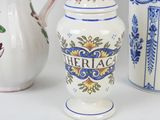 three different types of vases sitting on a table