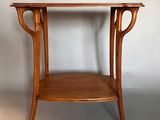 an image of a wooden table with a shelf underneath it