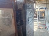 a large pile of boxes and other items in a warehouse
