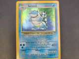 a close up of a pokemon card sitting on top of a table