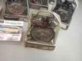 many different types of alarm clocks on the table