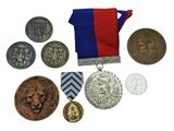 many medals and medals that are on a white surface