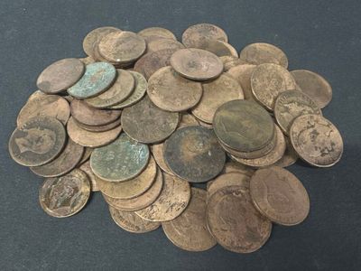 a pile of old coins sitting on a table