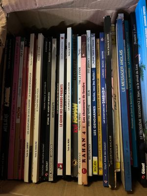 a box full of books that are sitting on a table