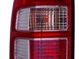 a close up of the tail light of a red car