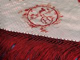 a close up of a table cloth with a pentagram design on it