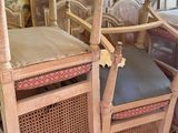 several chairs and a bed in a room