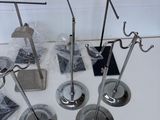 four metal tools that are sitting on a table