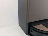 an image of a robotic vacuum cleaner on a white surface