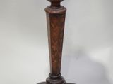 a wooden table with a vase on top of it