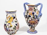 two vases sitting next to each other on a white surface