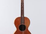 a close up of an acoustic guitar on a white background