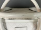 a close up of a white purse with a handle