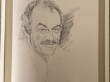 portrait of a man with a mustache and a moustache in a silver frame