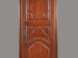 an image of a wooden cabinet with a door in the middle