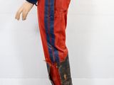 a doll of a man dressed in a red and blue uniform