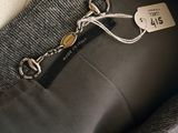 a close up of a person ' s jacket with a tag on it