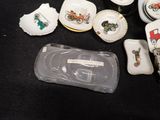 a lot of small dishes and cups on the table