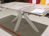 a white table with a marble top and a book on it