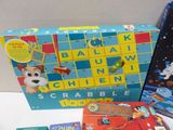 several children ' s board games and books on the table