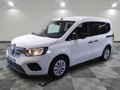the white van is parked on a checkered tile floor