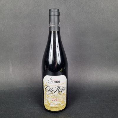 a bottle of wine sitting on top of a table
