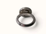 an image of a ring with diamonds on it