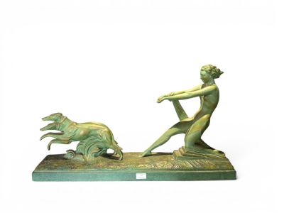 statue of a man and a dog on a base