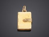 a gold locke with a key on a black background