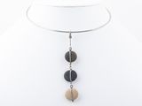 a close up of a necklace on a mannequin neck